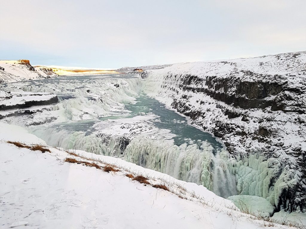 The icy cold waters of Gulfoss pour down.