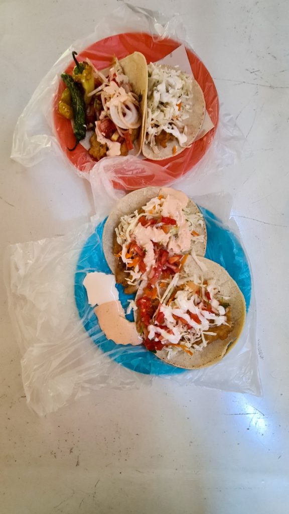 The locally-run taco restaurant El Estadio offers a selection of tacos and toppings, all delicious.