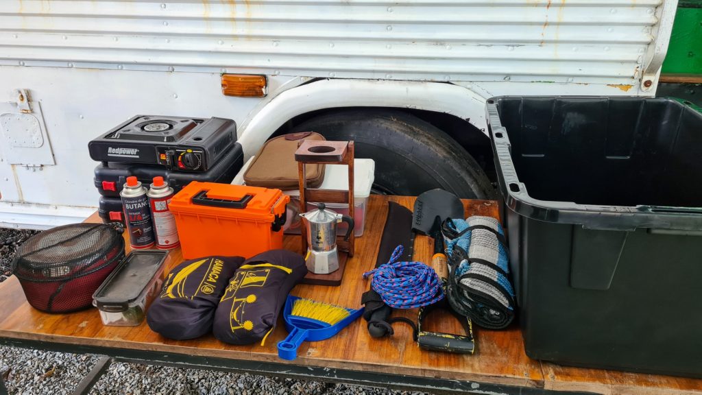Equipment provided by Nomad America including cooking equipment, shovel and machete.