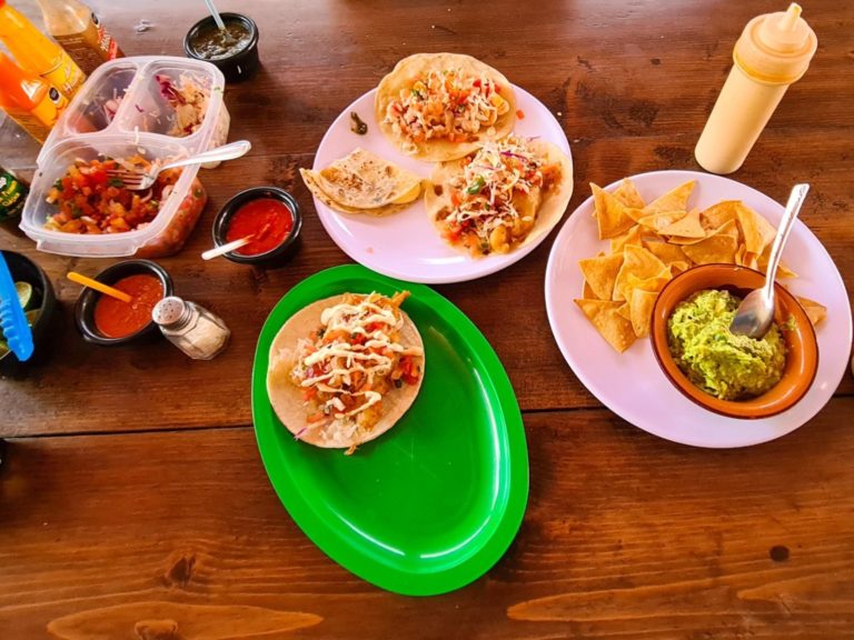 A table of delicious tacos, totopos and dips at McFisher, La Paz.