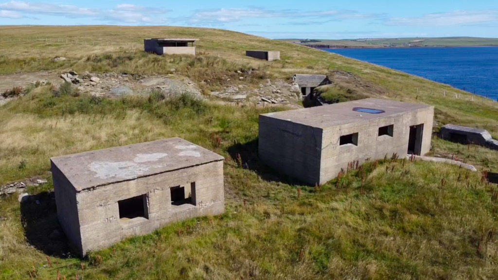An airal view of a few plane concrete buildings. These are what is left of the World War Two bunkers that once stood at Hoxa Head.