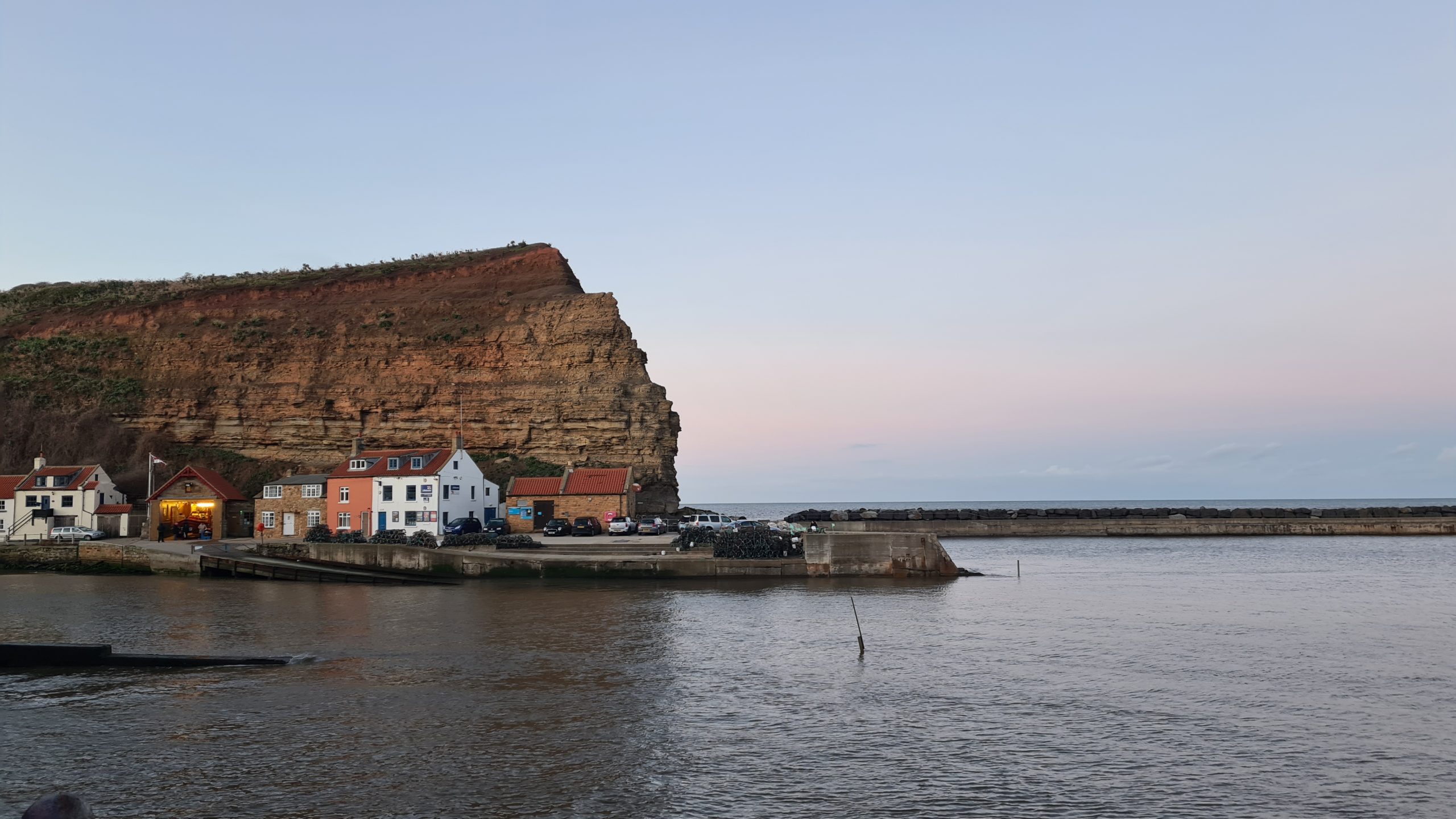 A handful of houses line the small port at Staithes.
