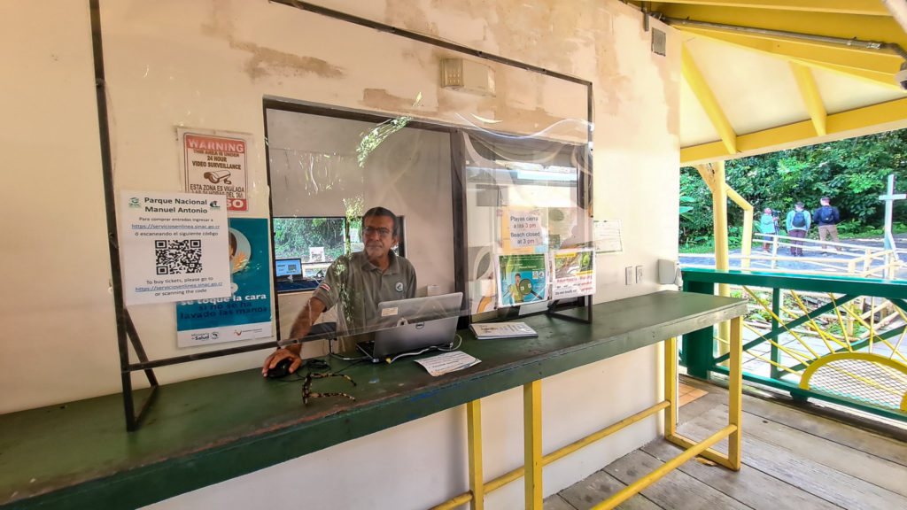 A man waits to sign in the next group of visitors to Manuel Antonio National Park.