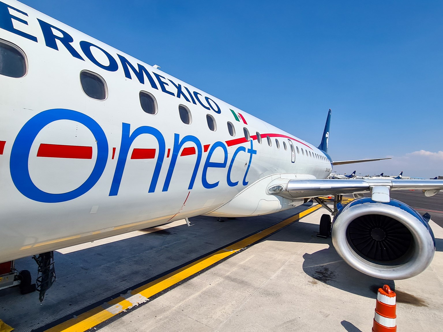 Accending the steps to board an Aeromexico plane, we can see right down the plan and into one of the turbine engines.