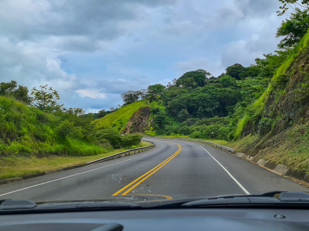 A view from the front of a car driving down an open road.