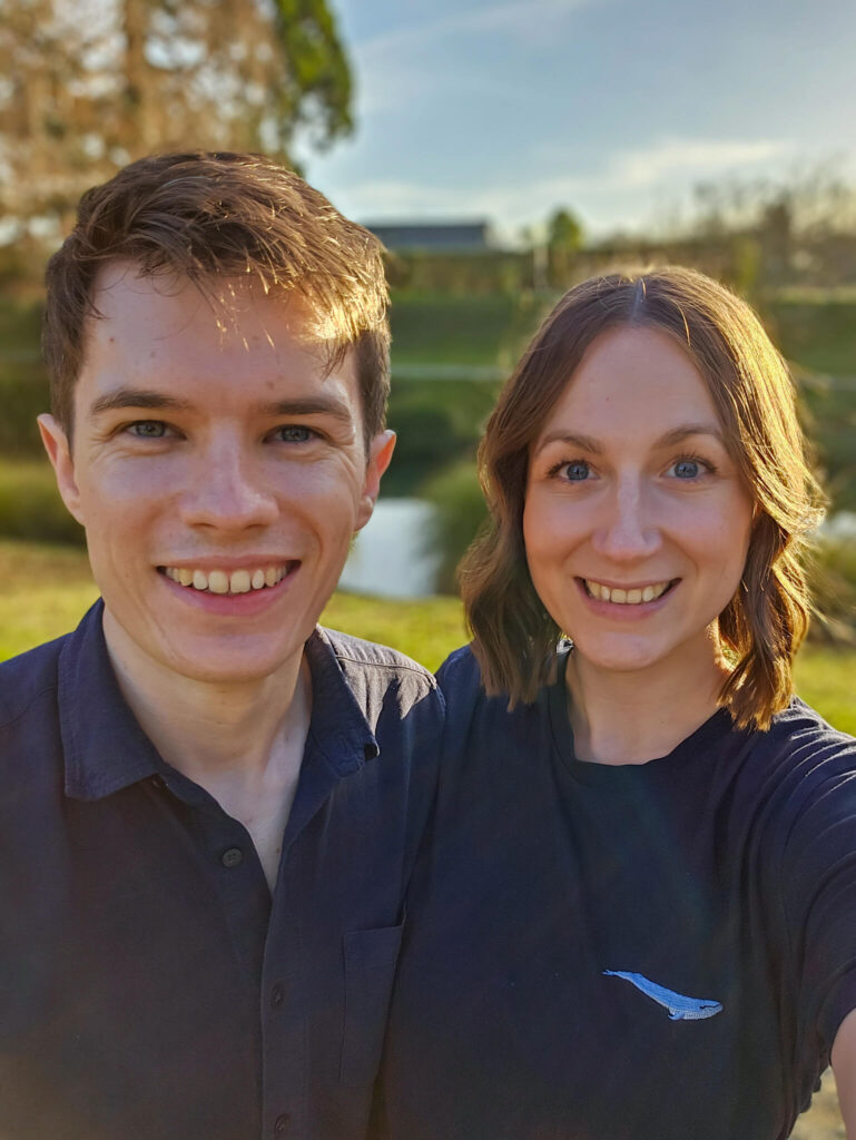 Lucy and Dan smile at the camera.