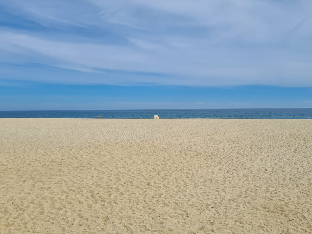 The clear white sand of a beach.