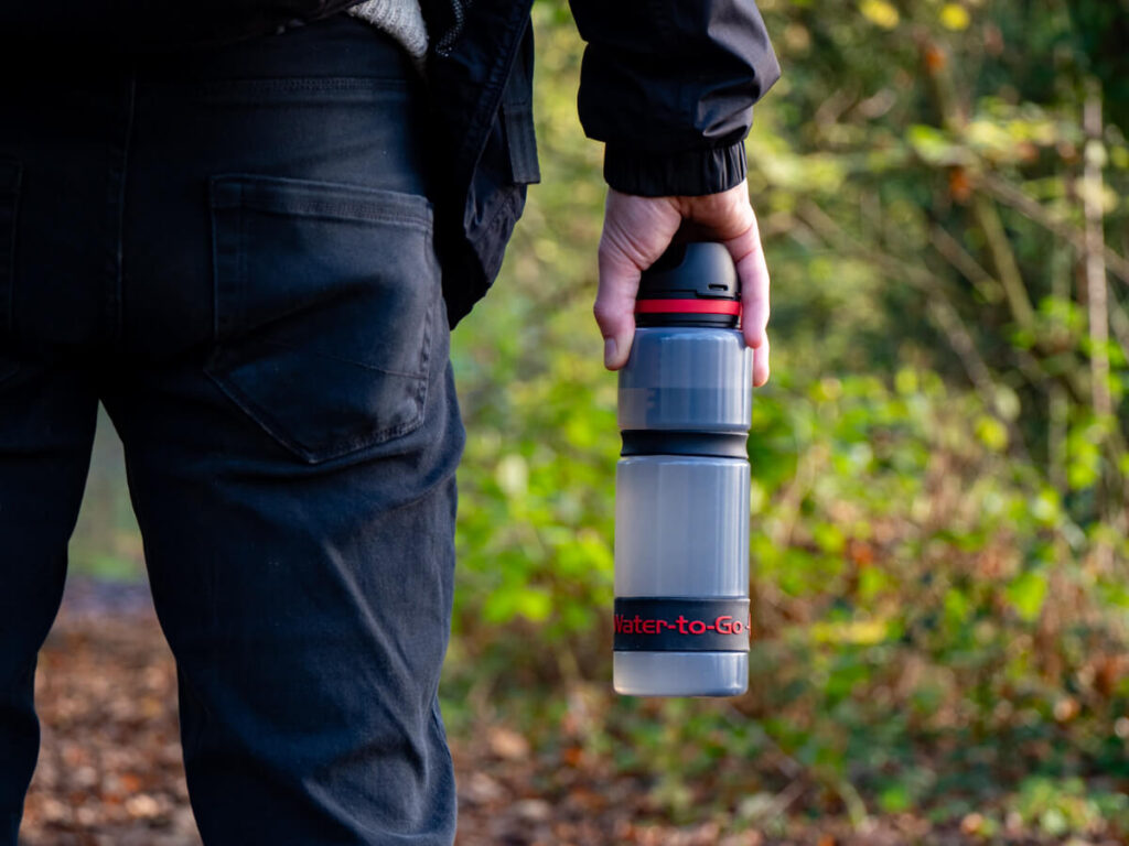 The filter inside a water bottle can clearly be seen through its translucent material.