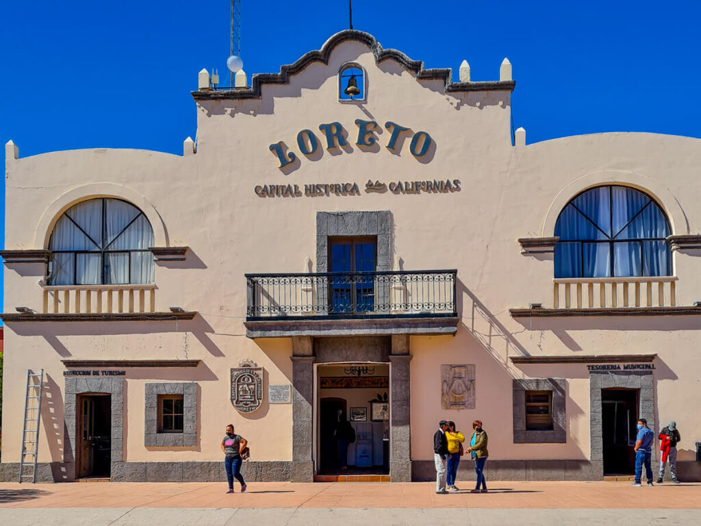 People standing in front of Loreto Town Hall.