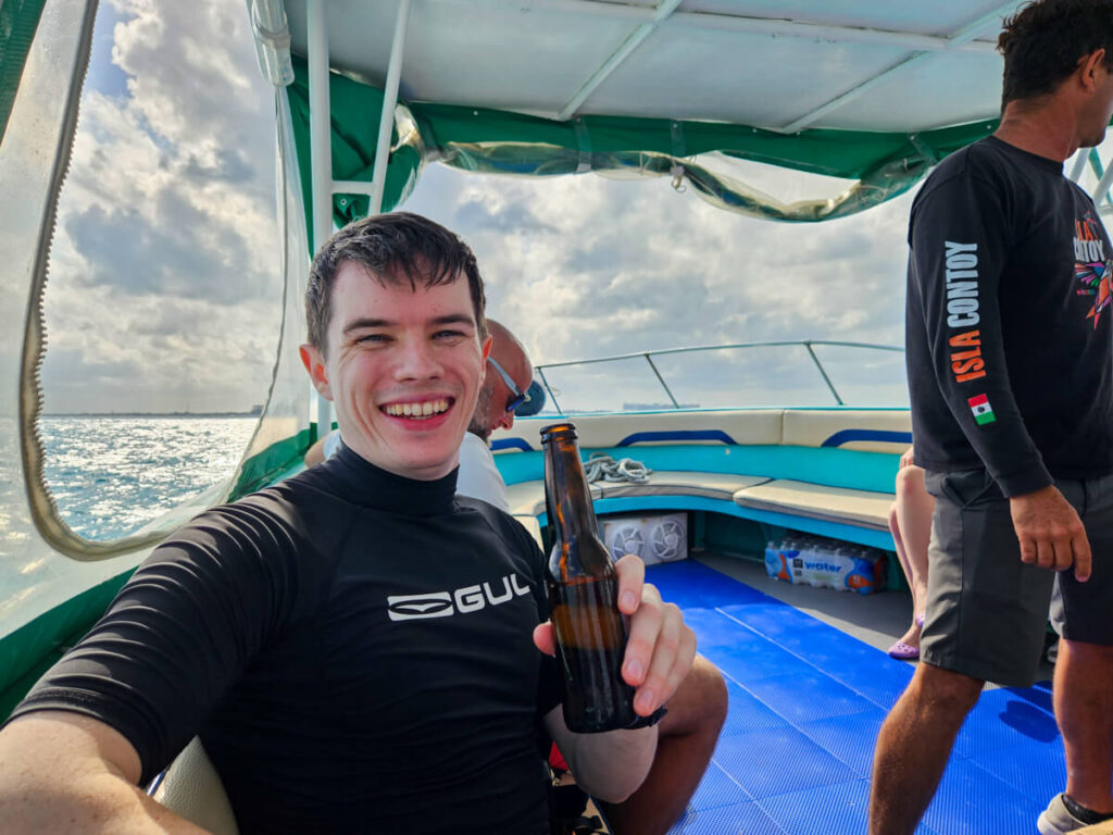 Dan smiling and holding a drink in his hand. He is on a tour with Ocean Tours Mexico.