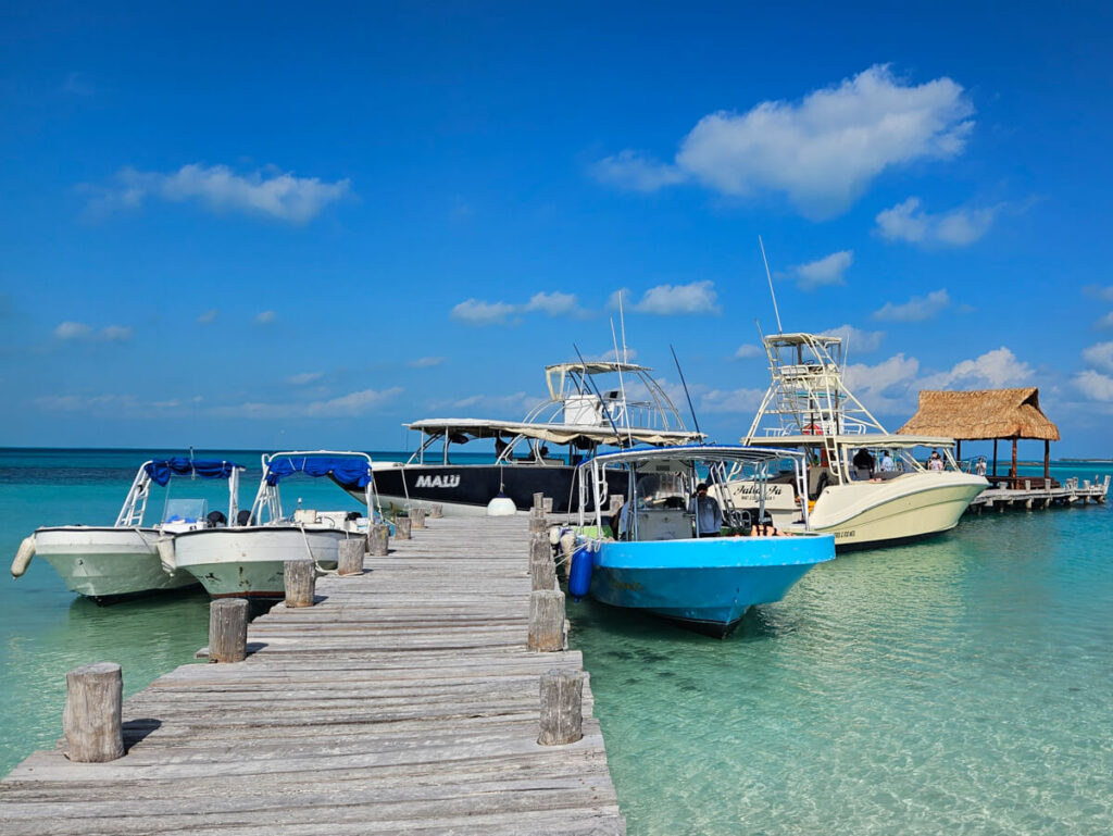 A small handful of boats docked at Isla Contoy. One of the best daytrips from Cancun.