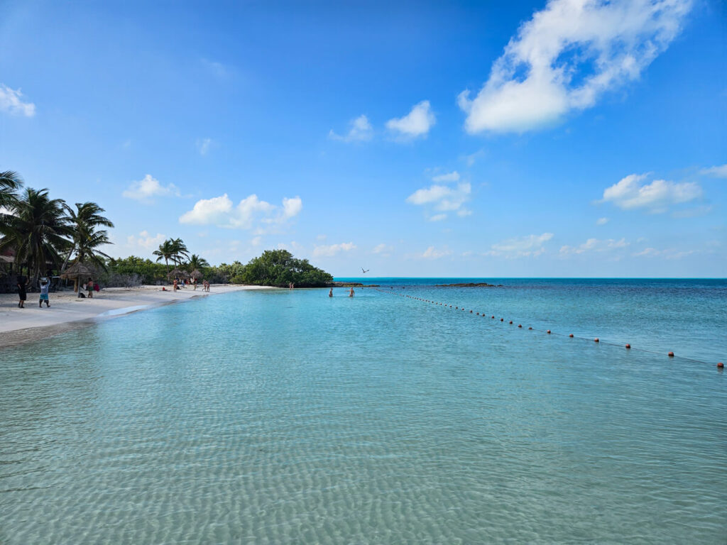 Visitors to Isla Contoy paddling in the clear, shallow water.
